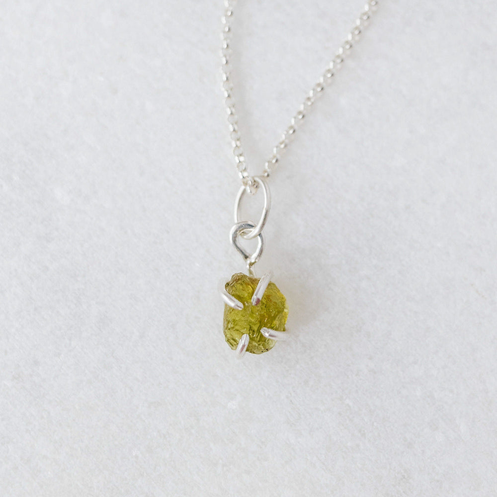 
            
                Load image into Gallery viewer, Raw peridot charm 
            
        