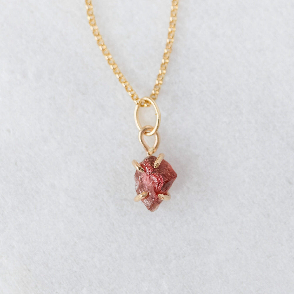 
            
                Load image into Gallery viewer, Raw garnet charm 
            
        